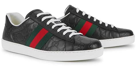 gucci embossed leather sneakers.